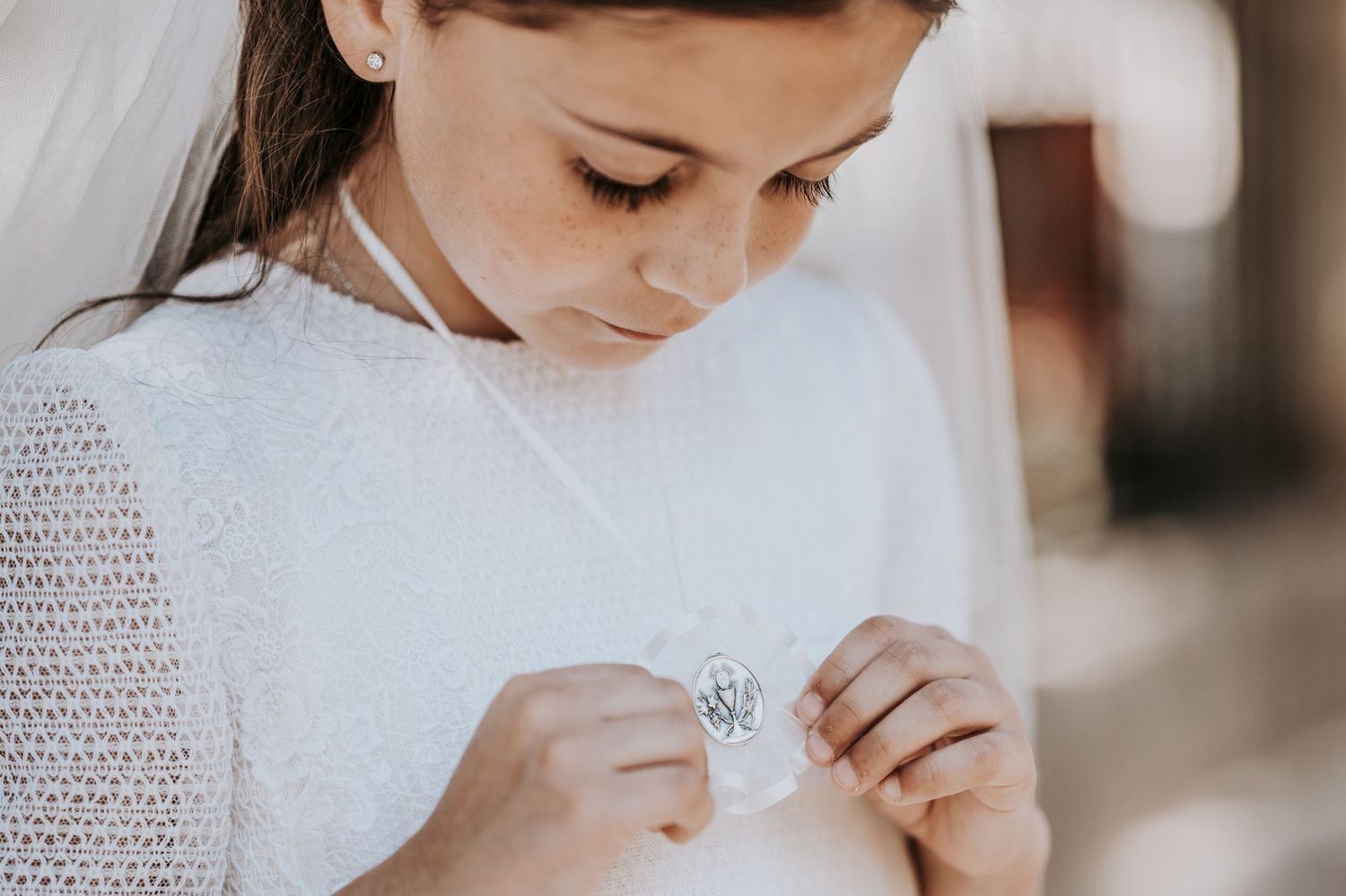 Close-up shots of delicate white lace details on a wedding dress.