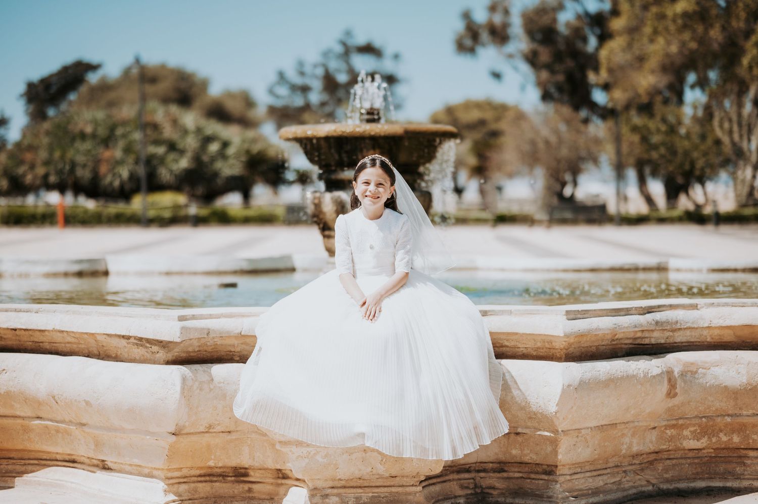 A series of photos featuring someone in white dress posed on rustic wooden structures outdoors.