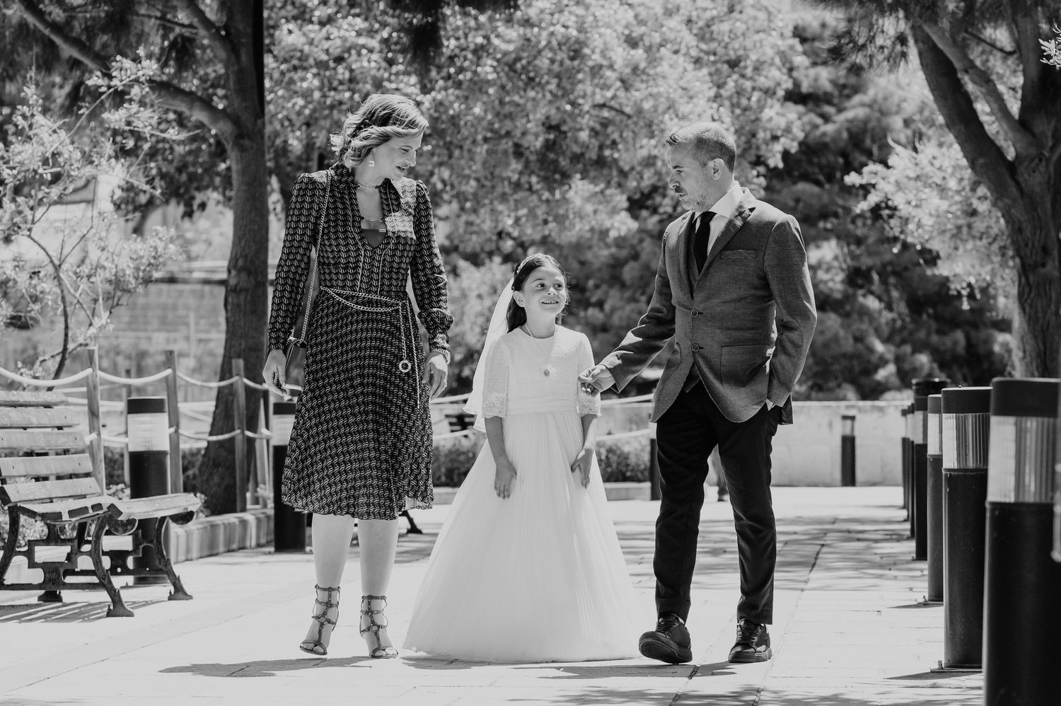 A sequence of joyful moments captured on a sunny path with trees in the background.