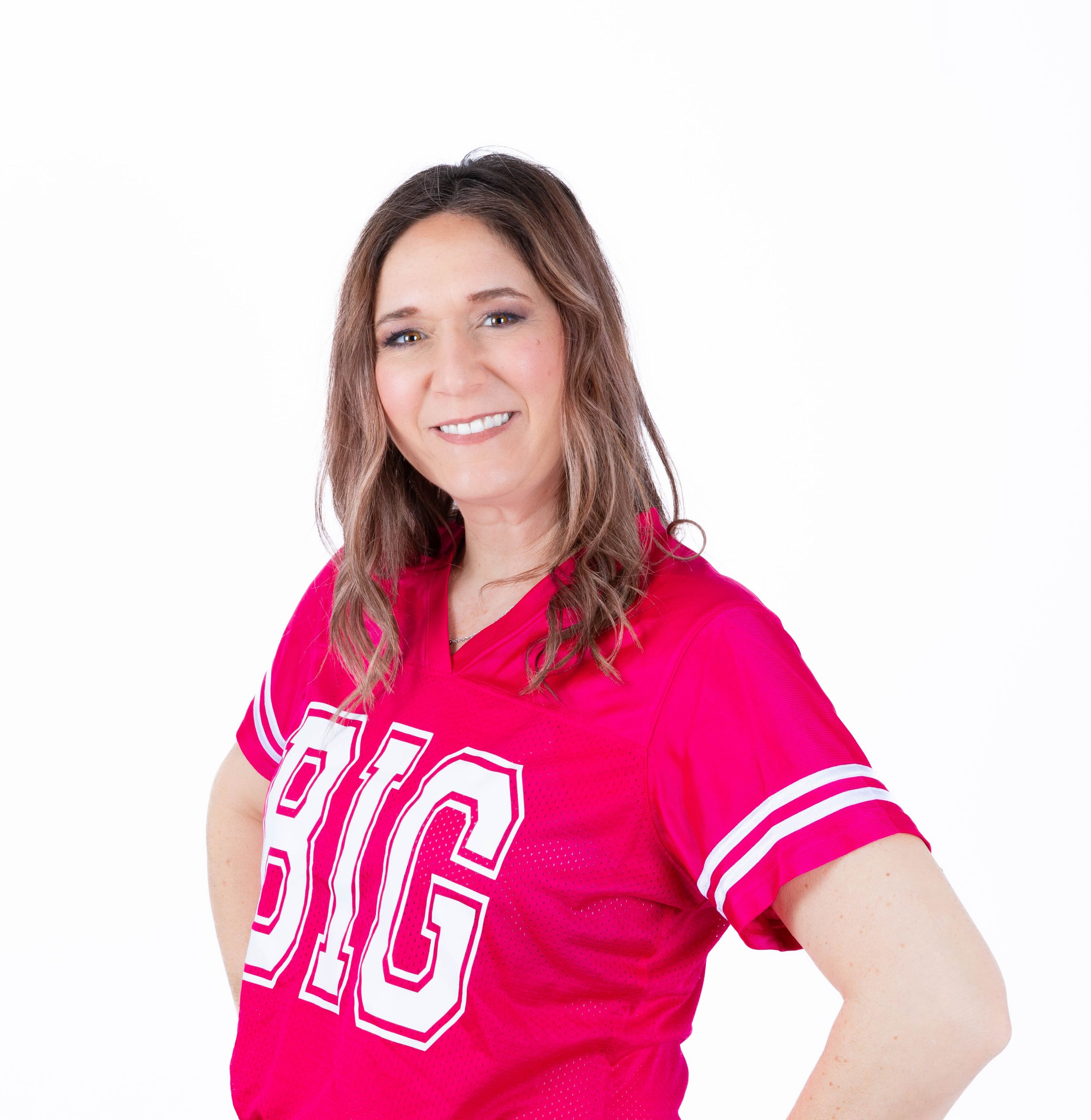 Woman in bright pink athletic shirt with white stripes shown in four different poses against white background.