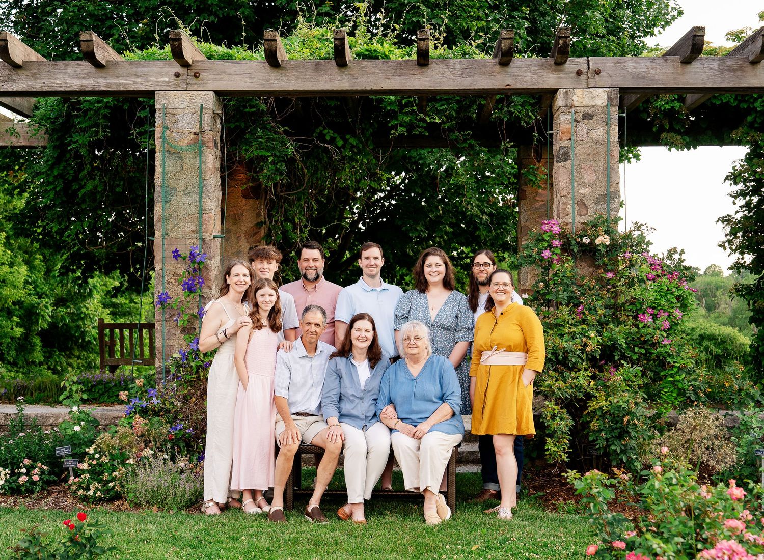 An extended family in front of a pergola at sunset taken by Milwaukee family photographer Rachel Dickman.