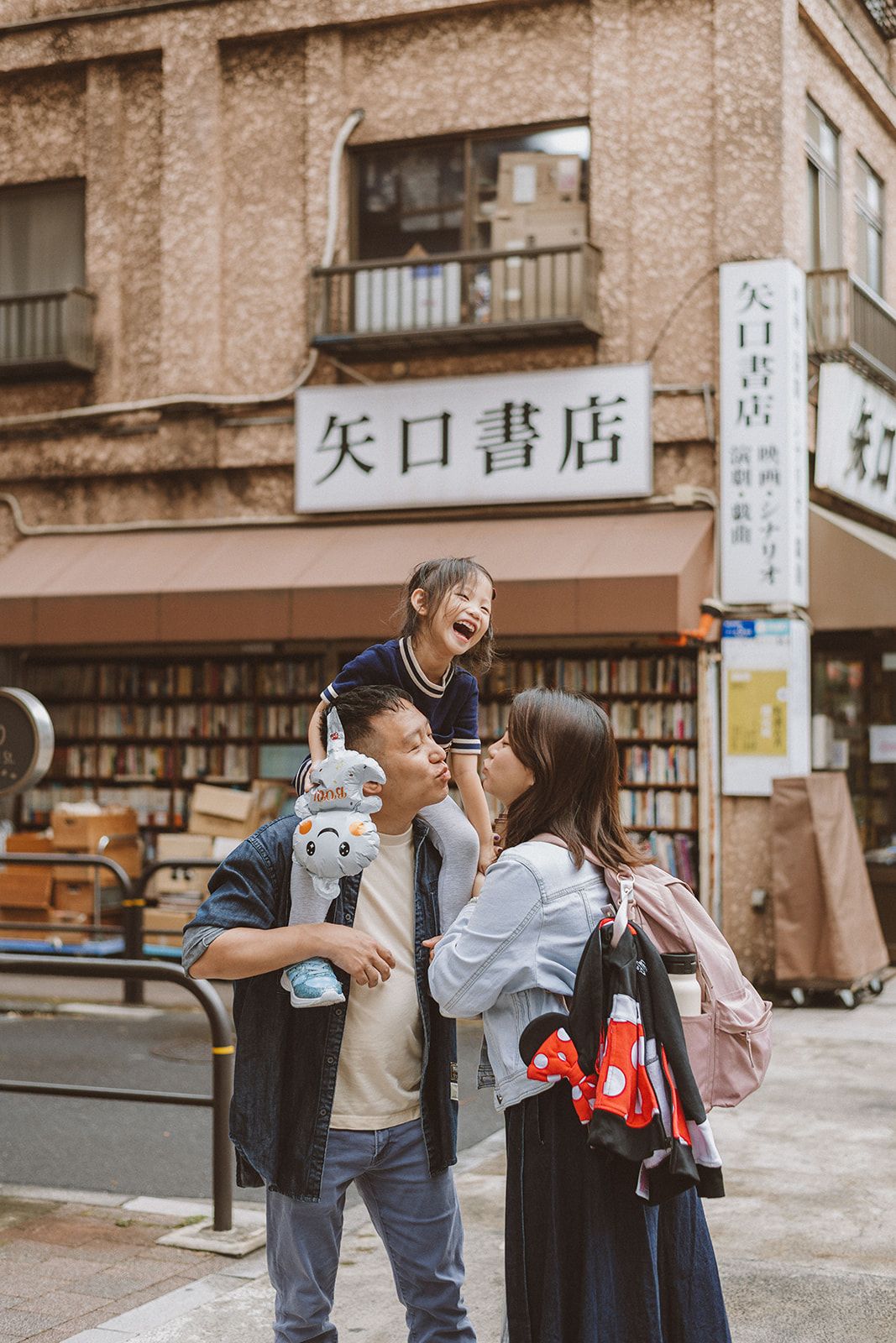 A smiling family in Jimbocho having a Family Portrait Session