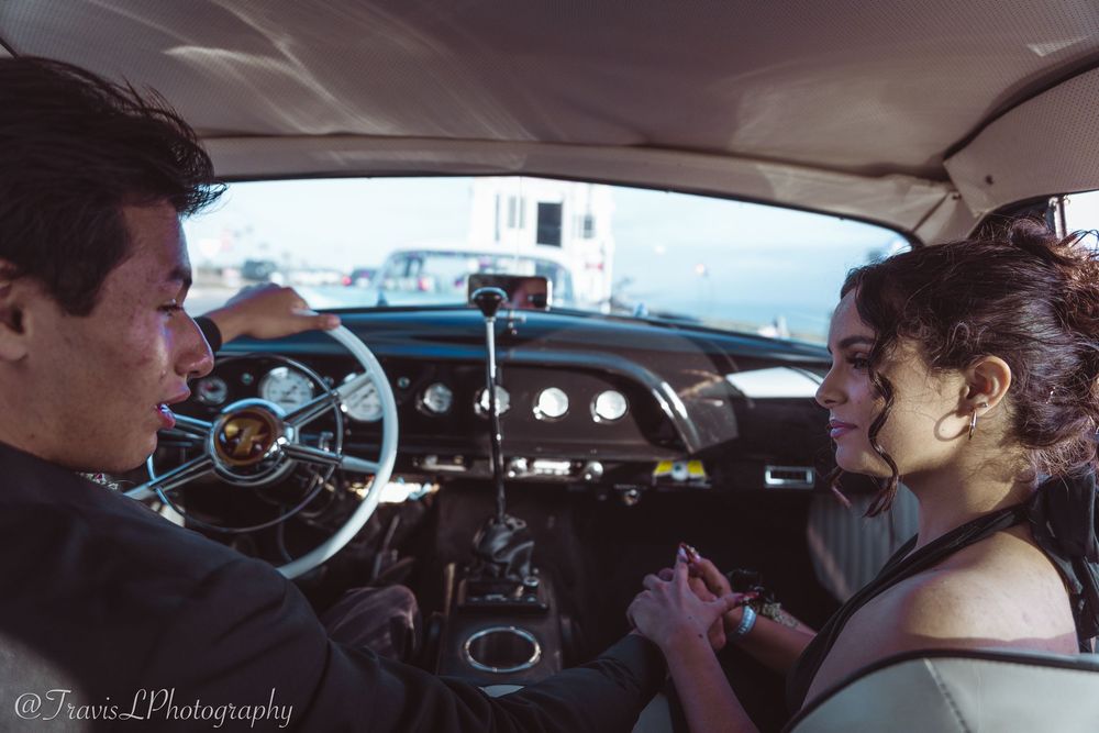 Interior view of people seated in a formal vehicle.