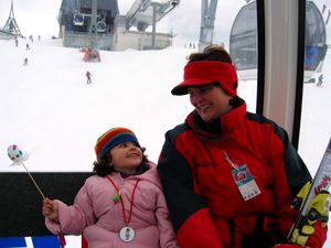A baby photo of a girl and her mom on a gondola
