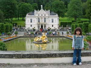 A baby photo of Brenna in front of a fountain in Austria