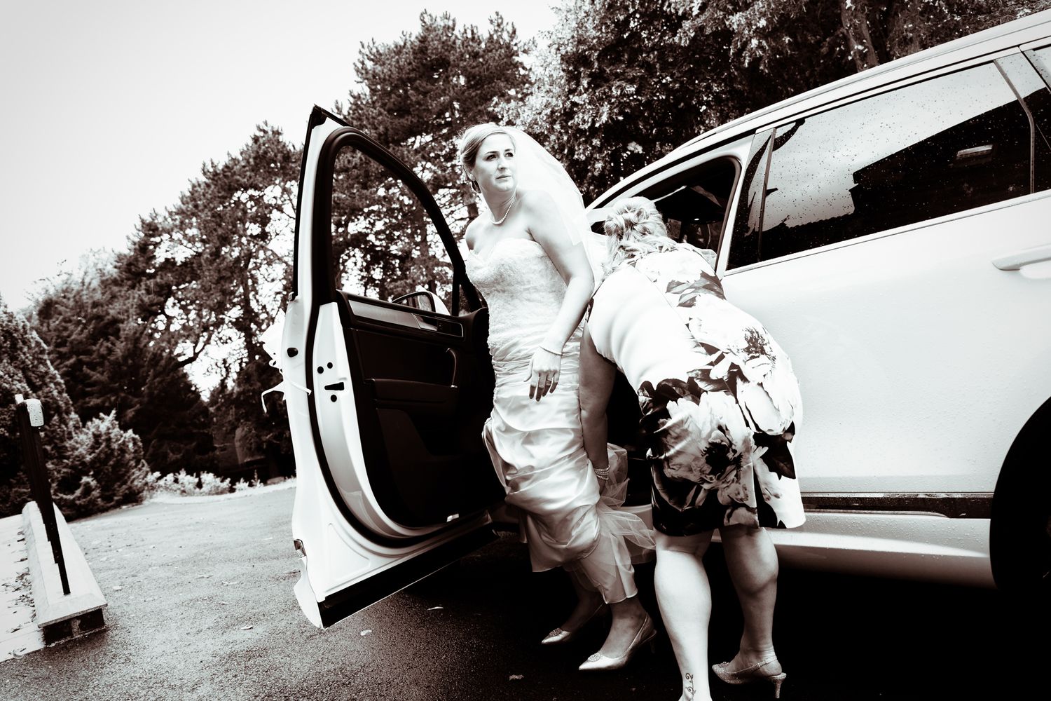Bride getting out the wedding car at a west midlands wedding.