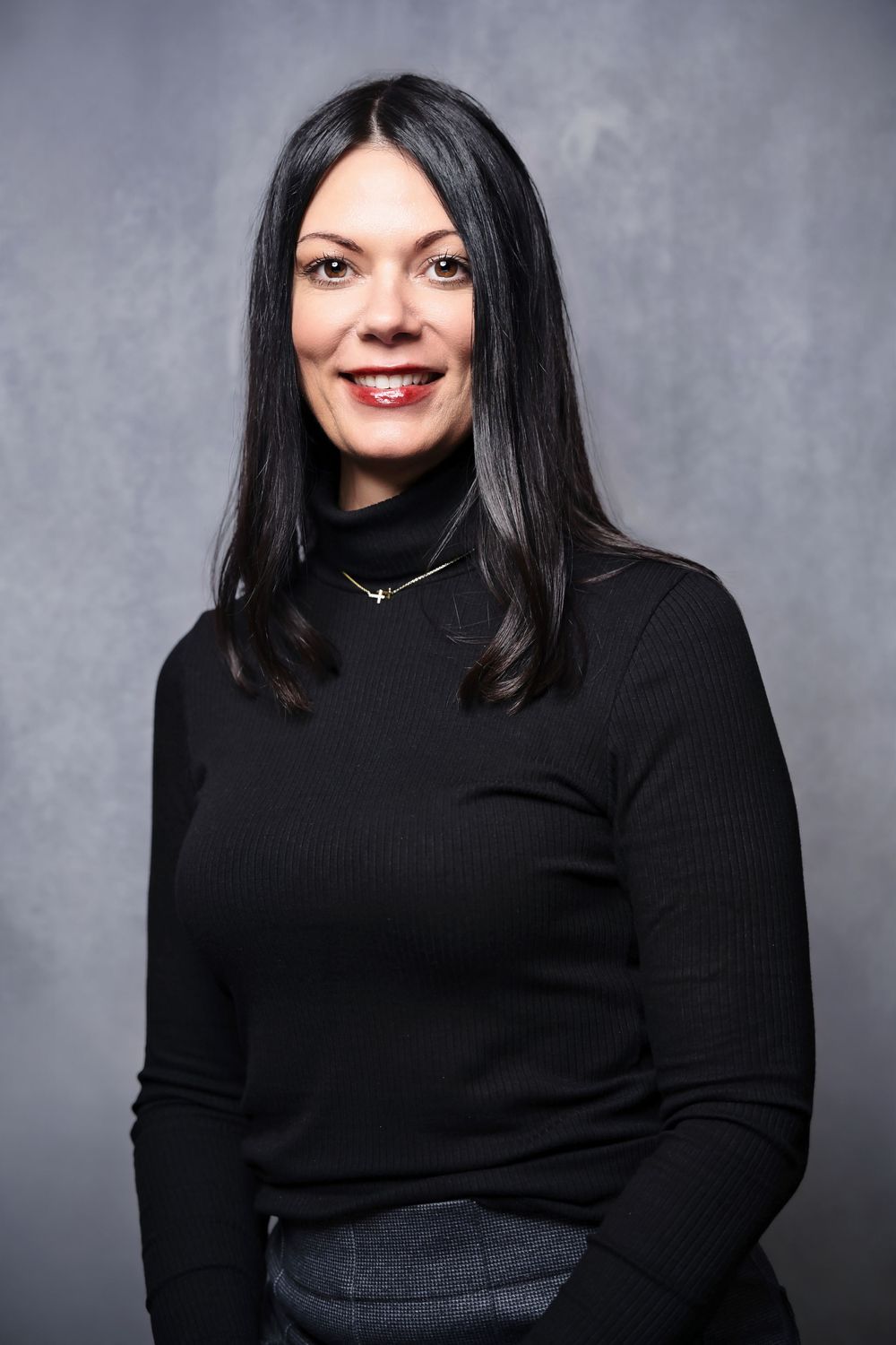 Portrait series showing a person in a black turtleneck sweater against a gray backdrop in different poses and expressions.