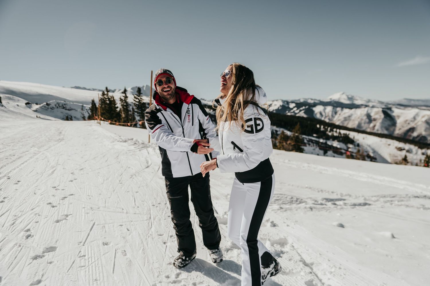 Engagement on the mountain. Fun ski slope photography.