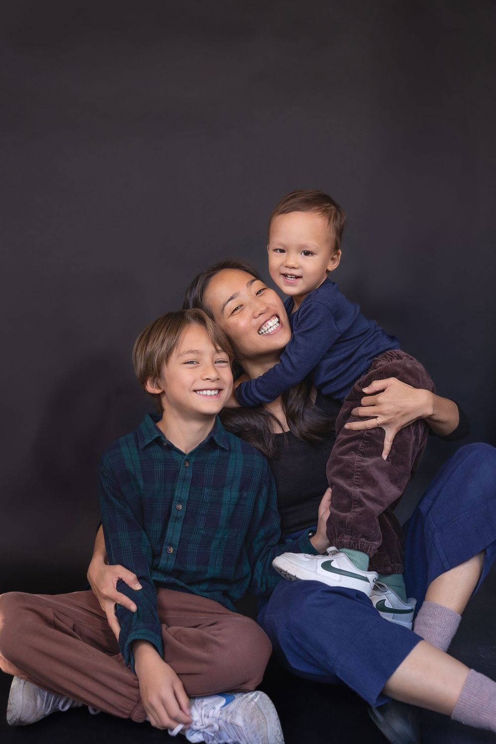 A playful photo sequence showing candid interactions and laughter against a dark background.