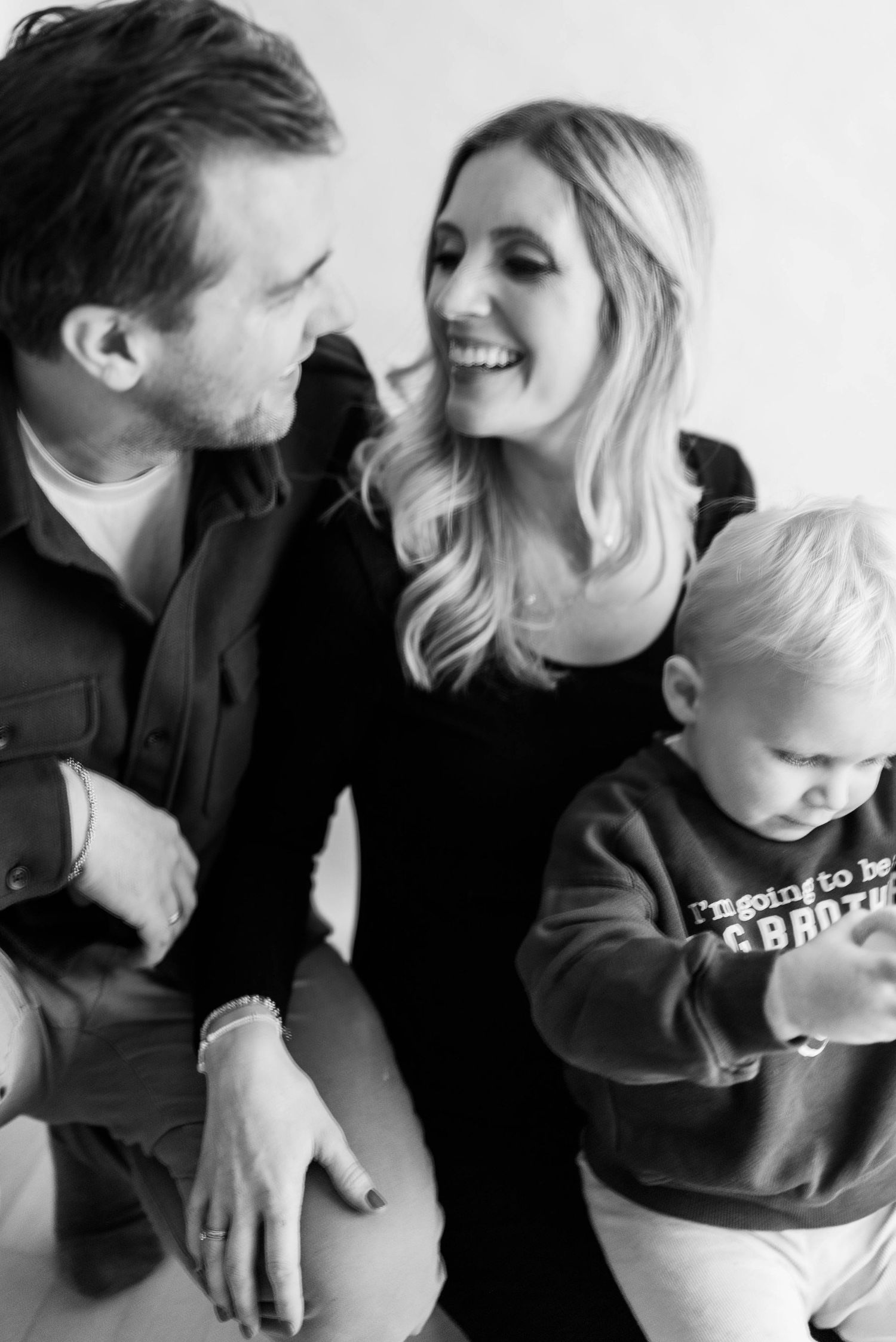 Intimate black and white family portrait capturing genuine emotions and connections.