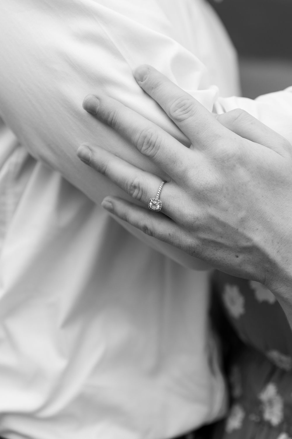 Close-up series of hands with an engagement ring showing affection.