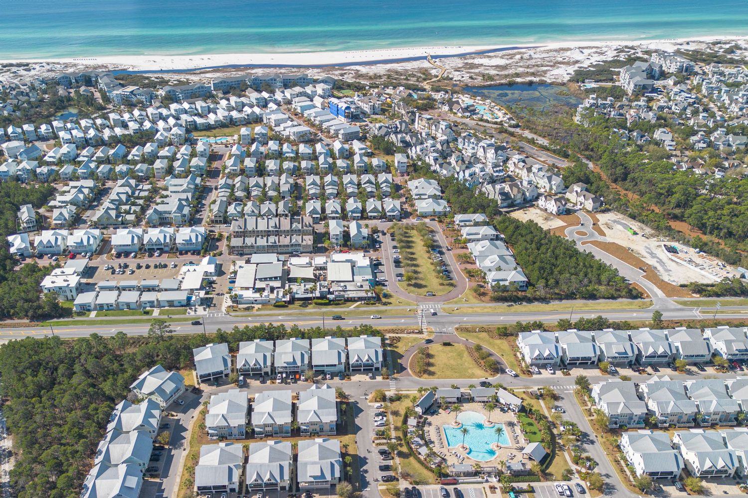 Aerial view showcasing the proximity of the beach to a property in 30A FL.