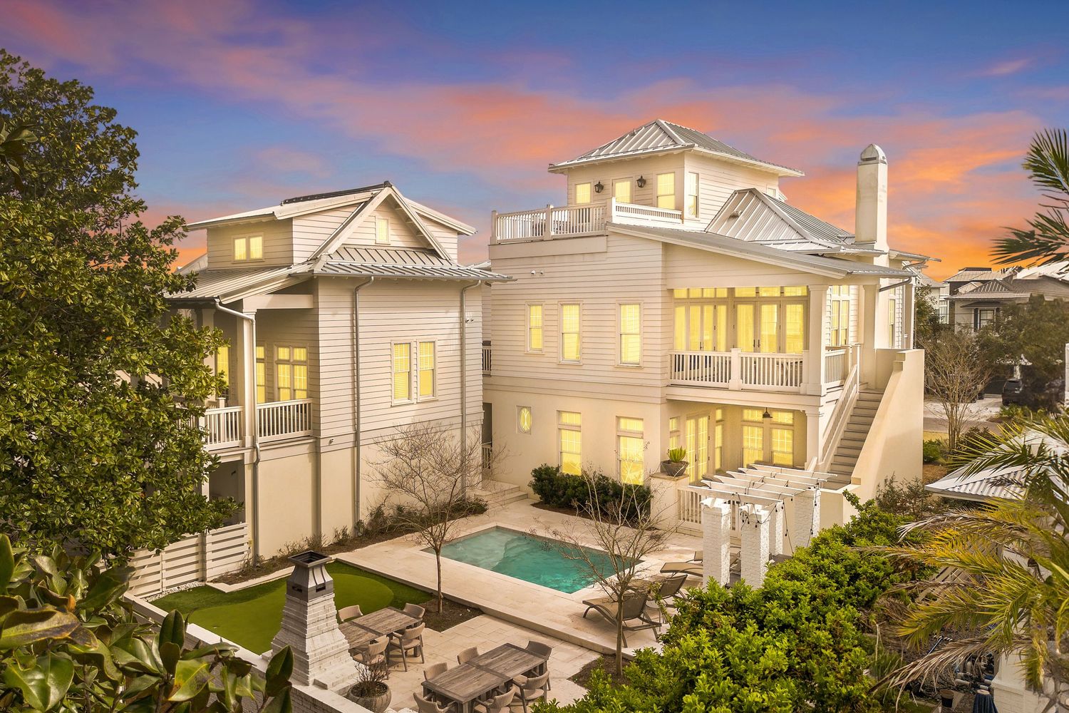 Aerial view of a captivating home listed in 30A FL, showcasing its coastal charm and surroundings, captured by drone.