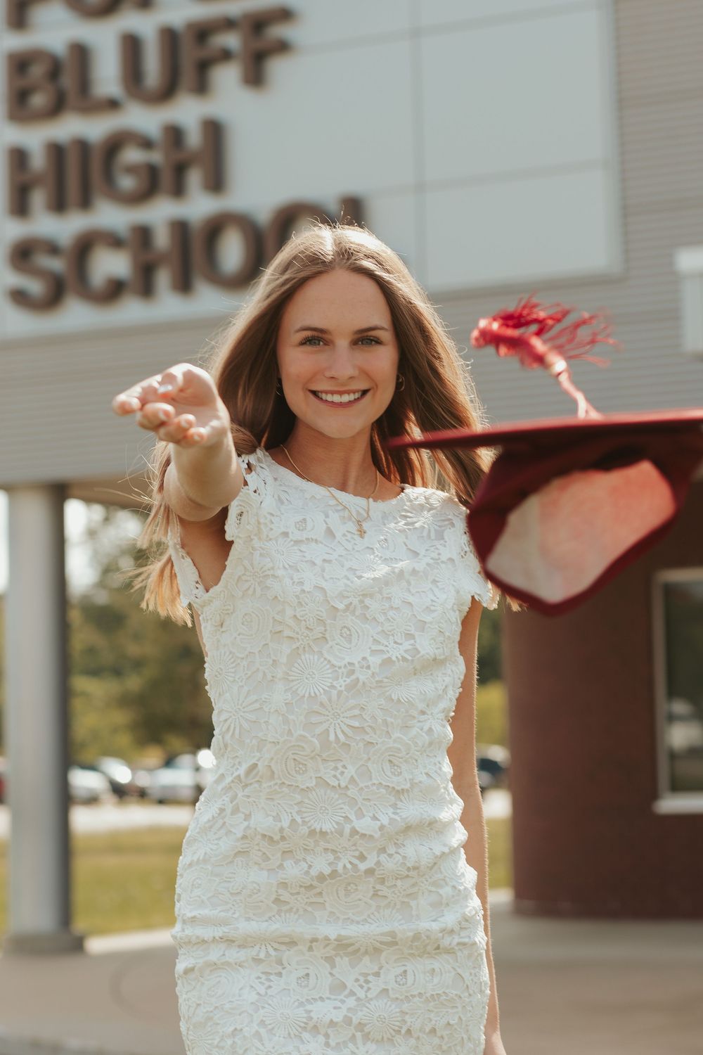 girl throwing her graduation cap