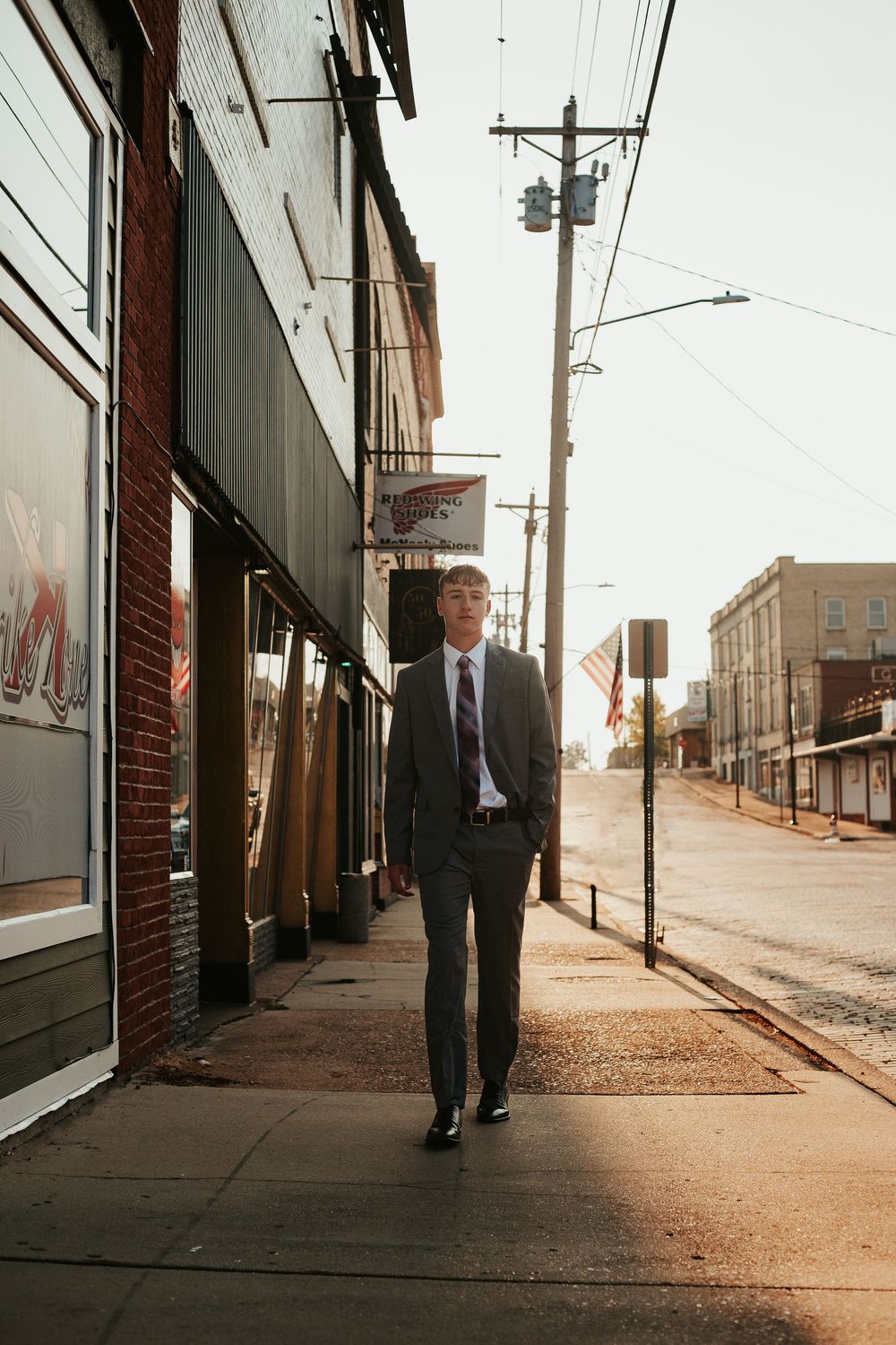 person walking on sidewalk downtown
