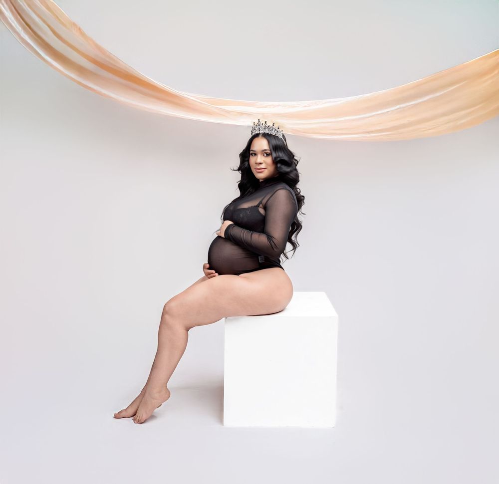 Minimalist maternity portrait sequence with draped peach fabric against light background.