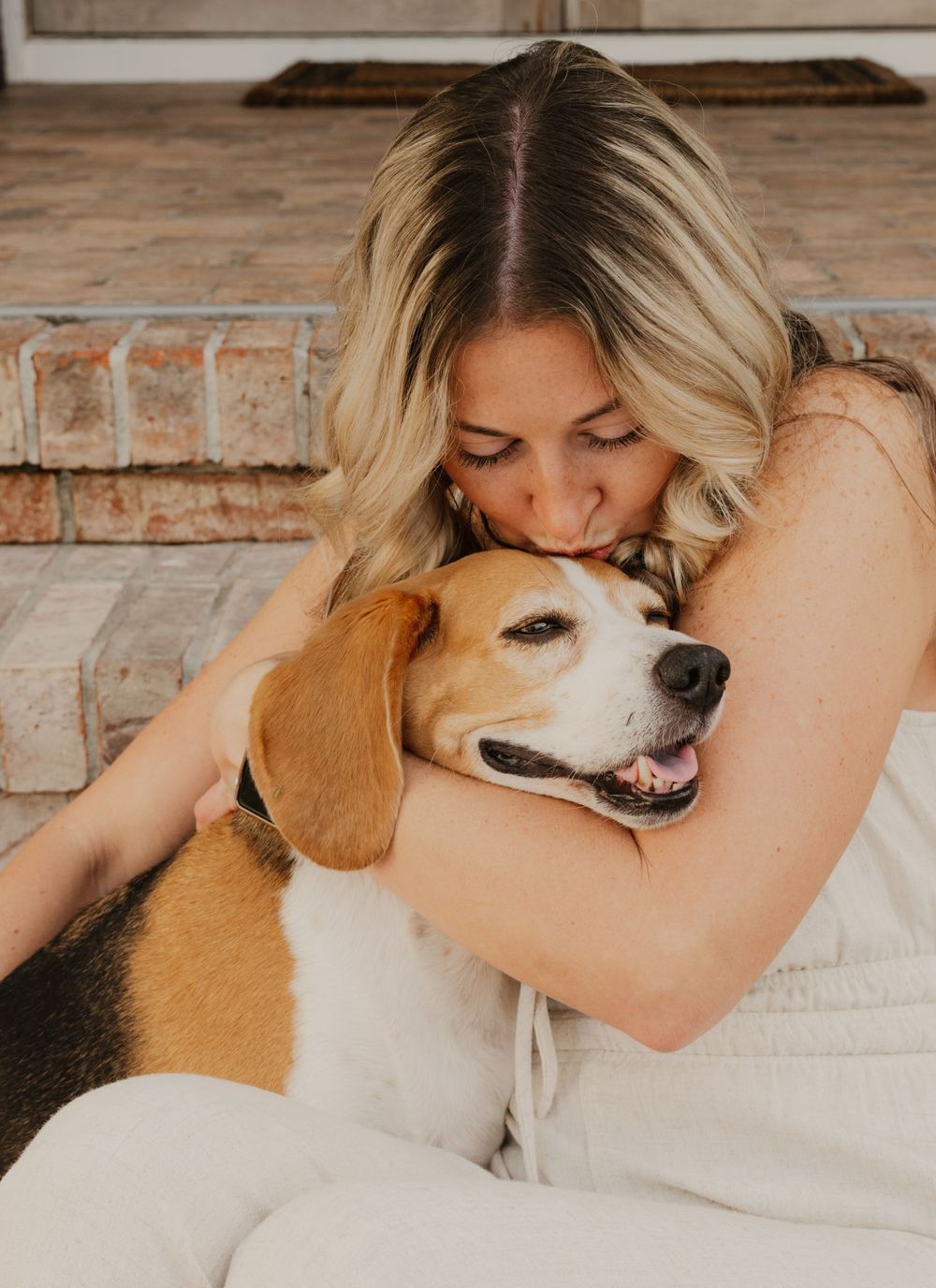A tender moment captured between a person and their beagle dog showing affection and bonding in a series of photos.