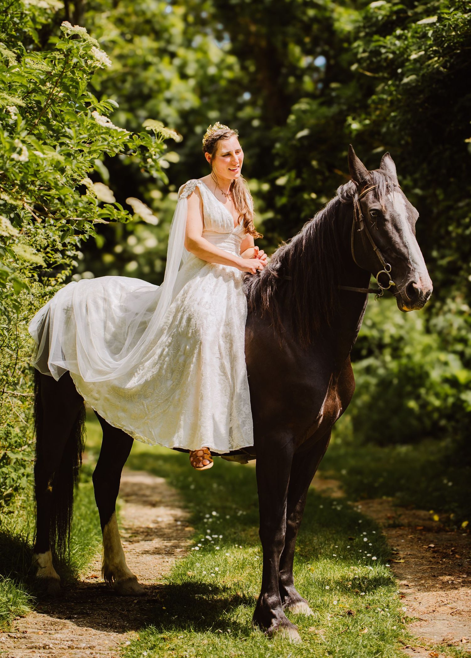 Bride on horse back on wedding day. Bridport wedding photographer. Horse at wedding