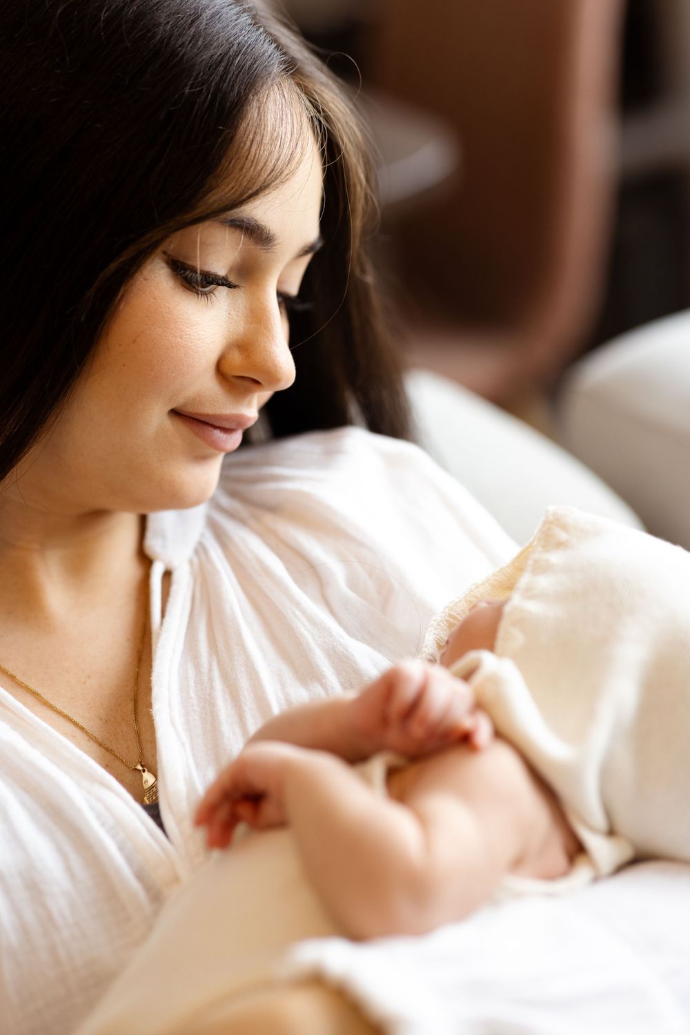 Tender moment of nurturing and bonding in soft natural lighting.