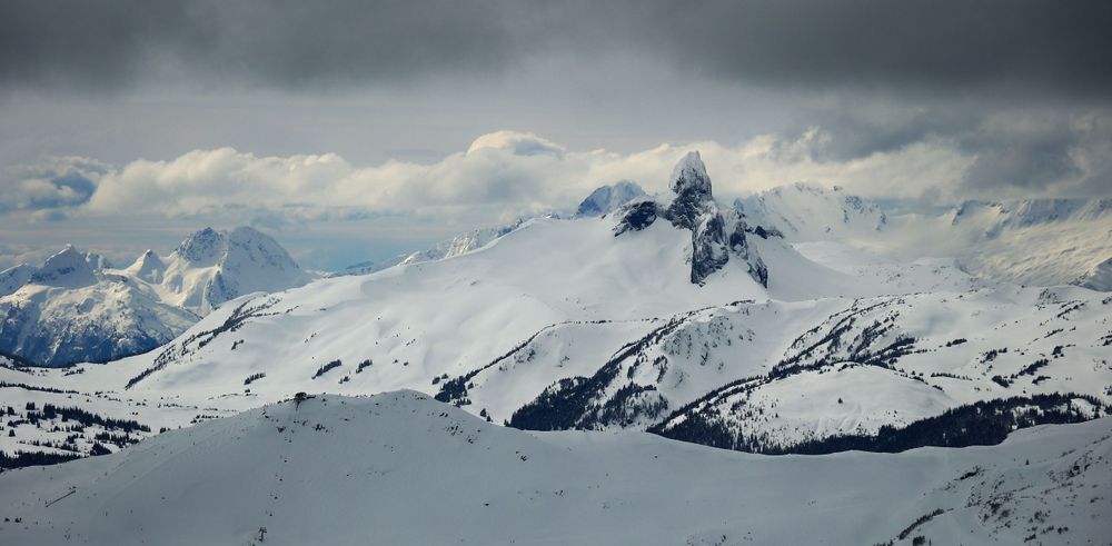 Dramatic snow-capped mountain peaks under moody cloudy skies in winter.
Whistler Blackcomb
Black Tusk