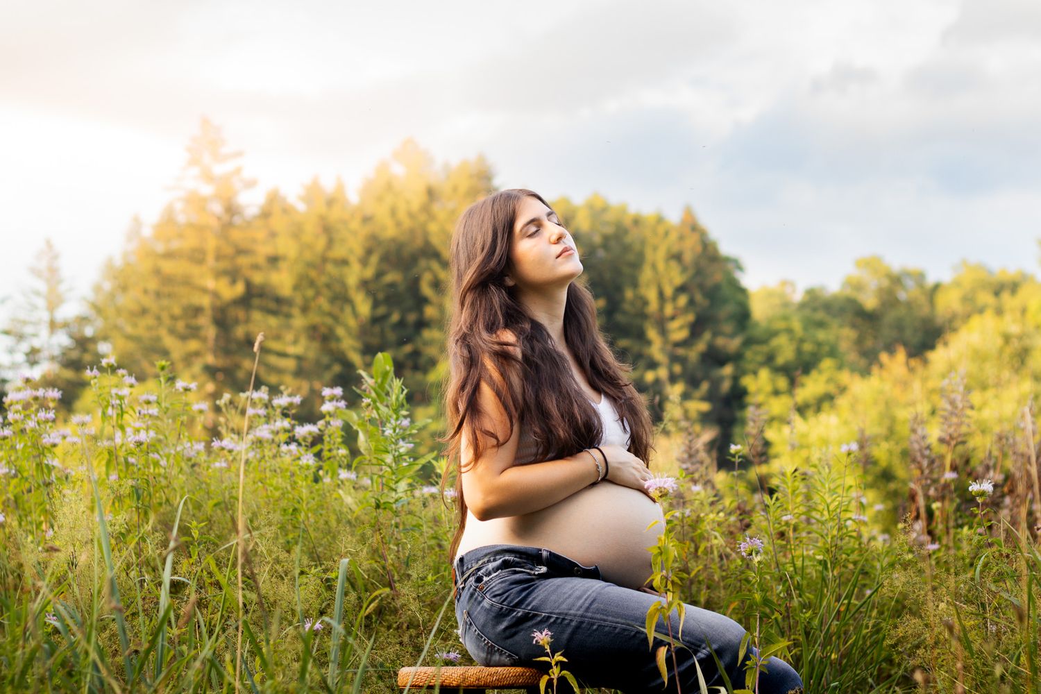 Maternity photoshoot in Vernon, Connecticut in a field with tall grass