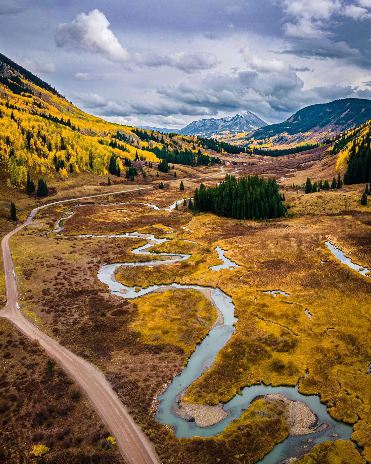 Aerial/drone photo of a River Valley in Crested Butte by by Denver Hospitality, Travel & Tourism photographer Captain Colorado Photography.