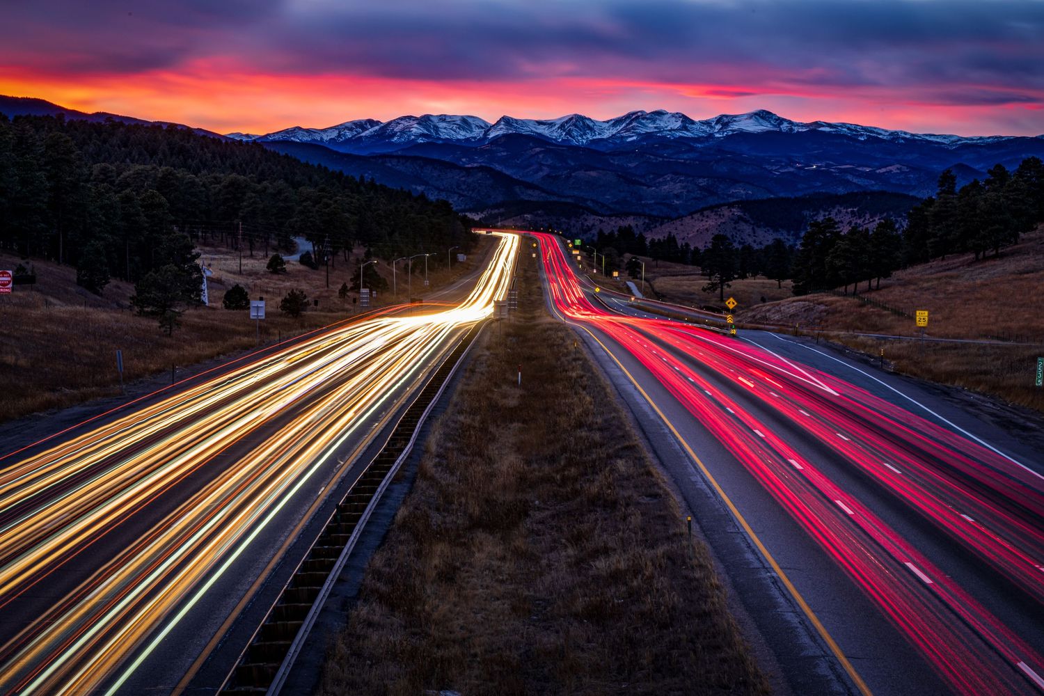 Light trails on I-70 at Gennessee Bridge by Denver Drone, Hospitality, Travel & Tourism photographer Captain Colorado Photography.