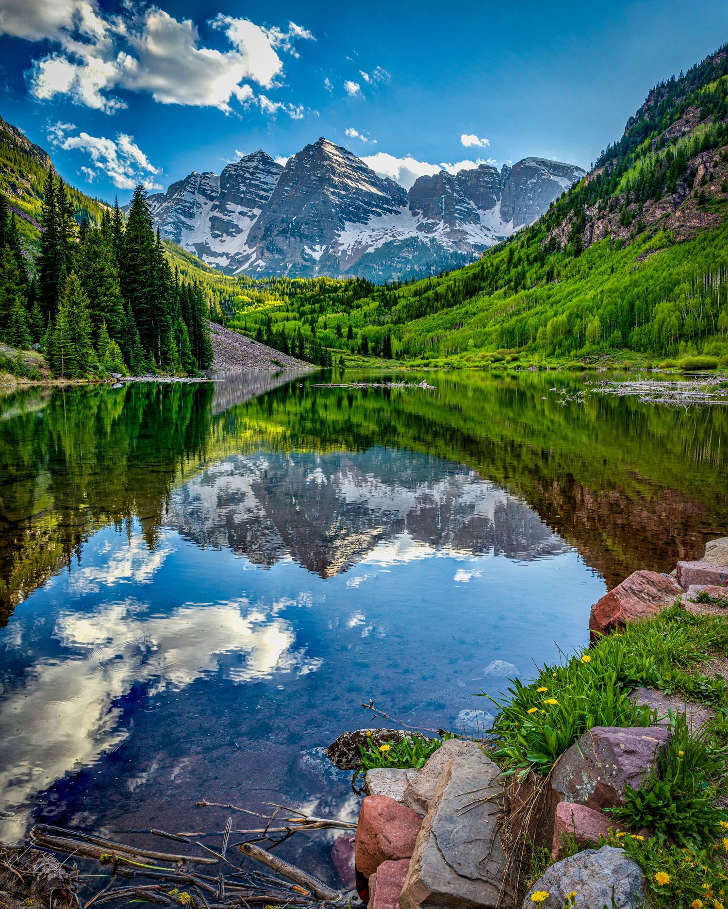 Reflection photo of Maroon Bells at sunrise by Denver Drone, Hospitality, Travel & Tourism photographer Captain Colorado Photography.