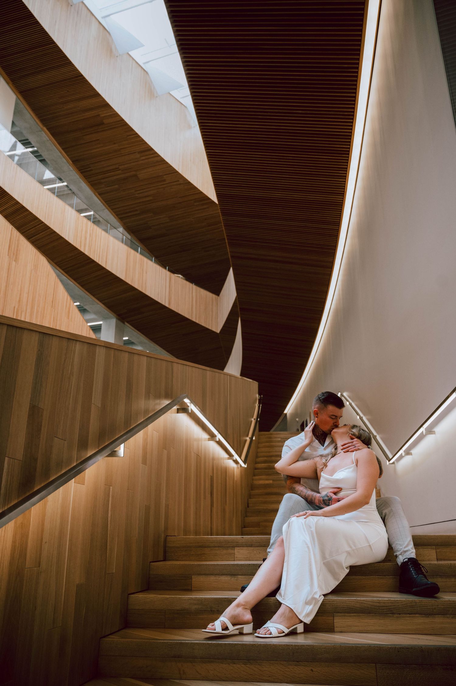 Engagement Photography - Couple Intimates at Central Public Library in Calgary, Alberta.