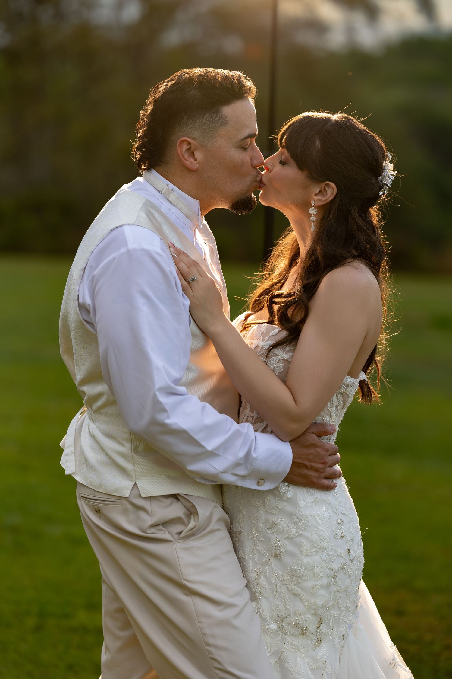 elated couple smiling and sharing a private moment with some cocktails before the reception