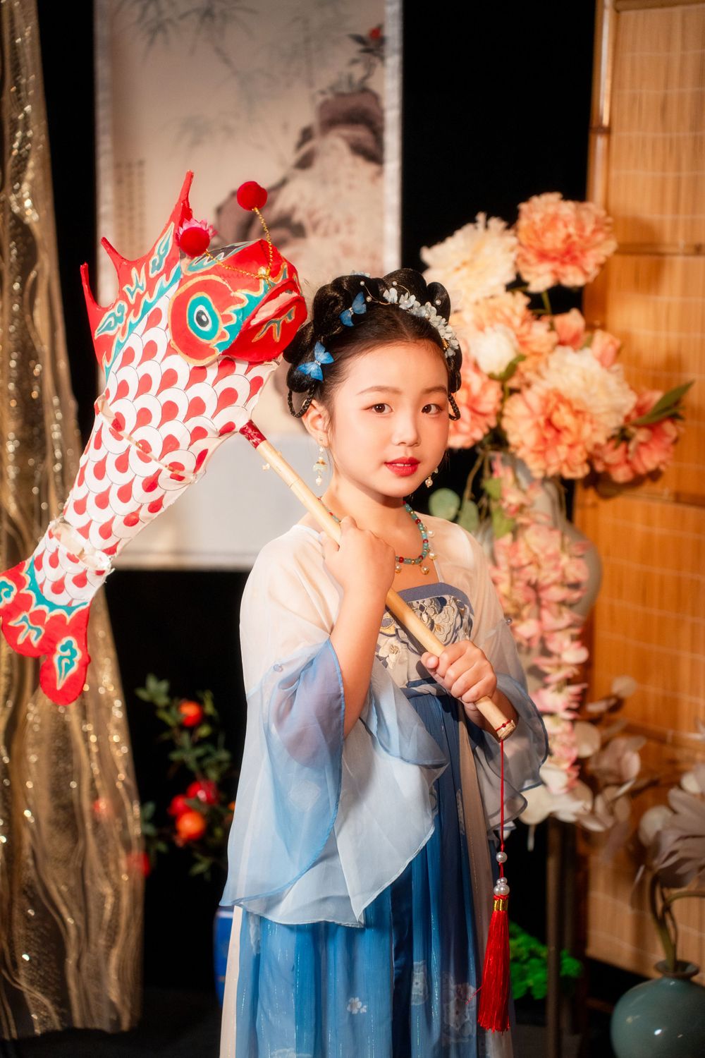 Cute children's studio portrait in an elegant Tang Dynasty Hanfu with dazzling golden props, by Imagine Image Studio.