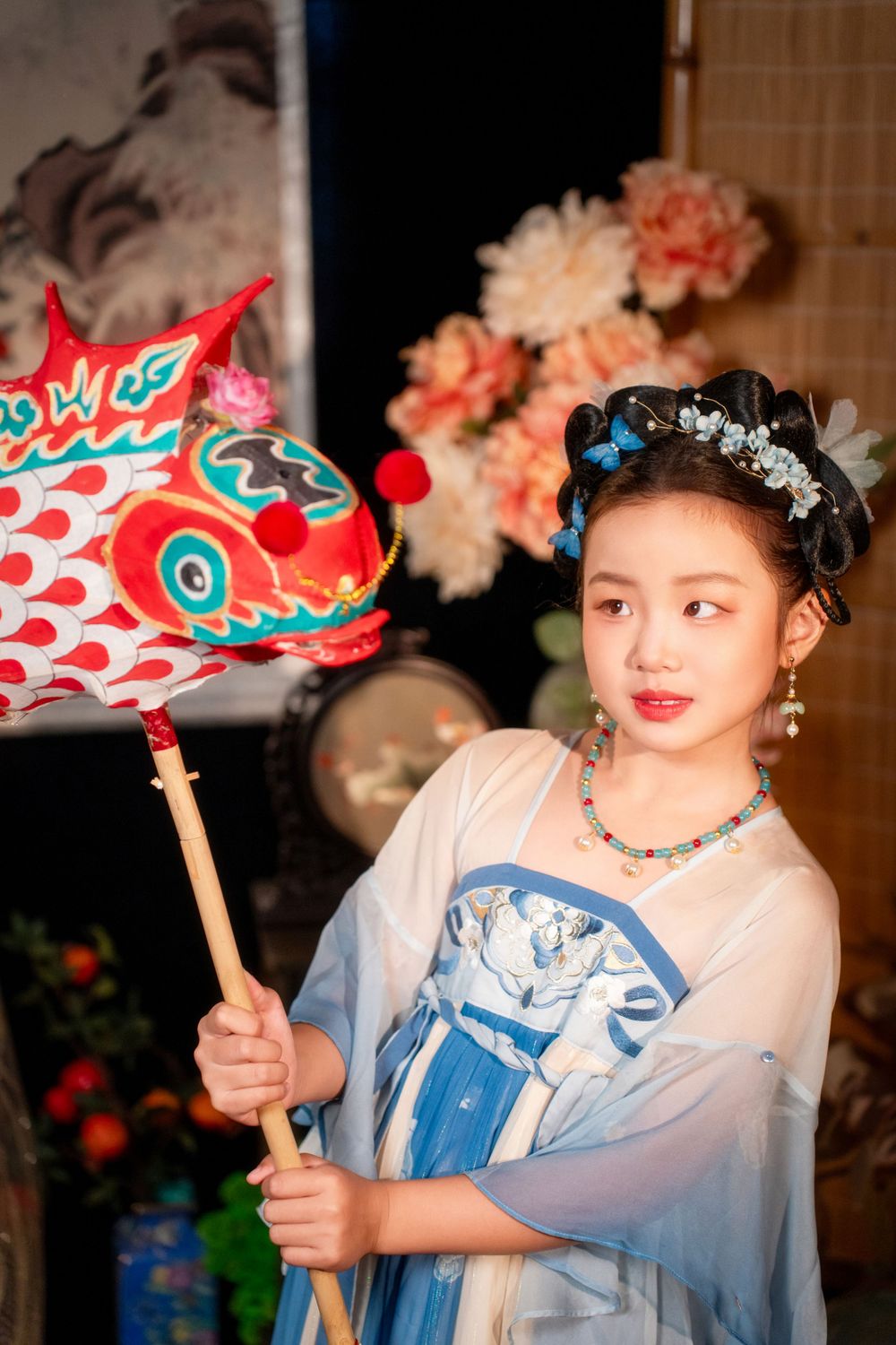 Cute children's studio portrait in an elegant Tang Dynasty Hanfu with dazzling golden props, by Imagine Image Studio.