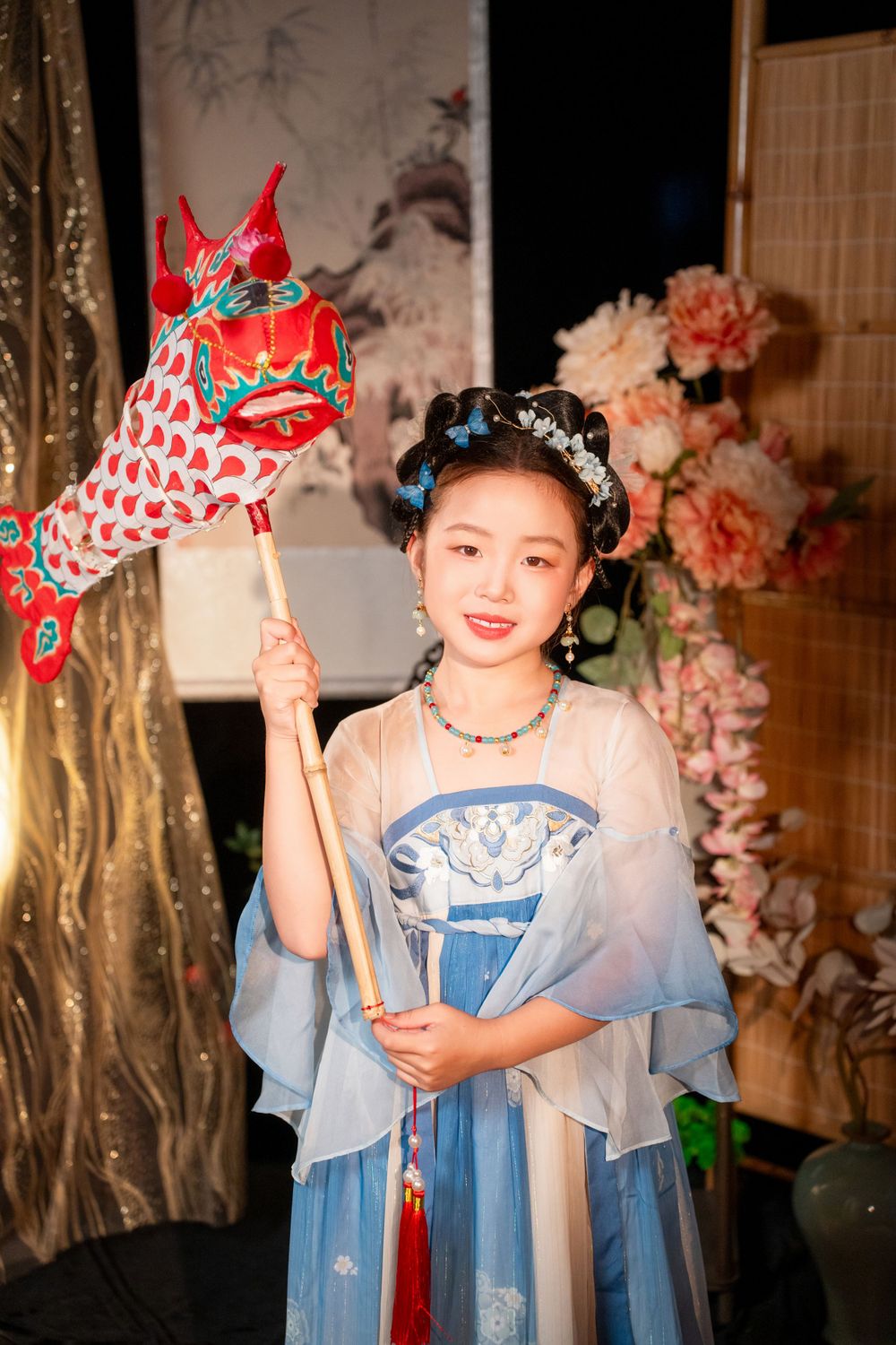Cute children's studio portrait in an elegant Tang Dynasty Hanfu with dazzling golden props, by Imagine Image Studio.