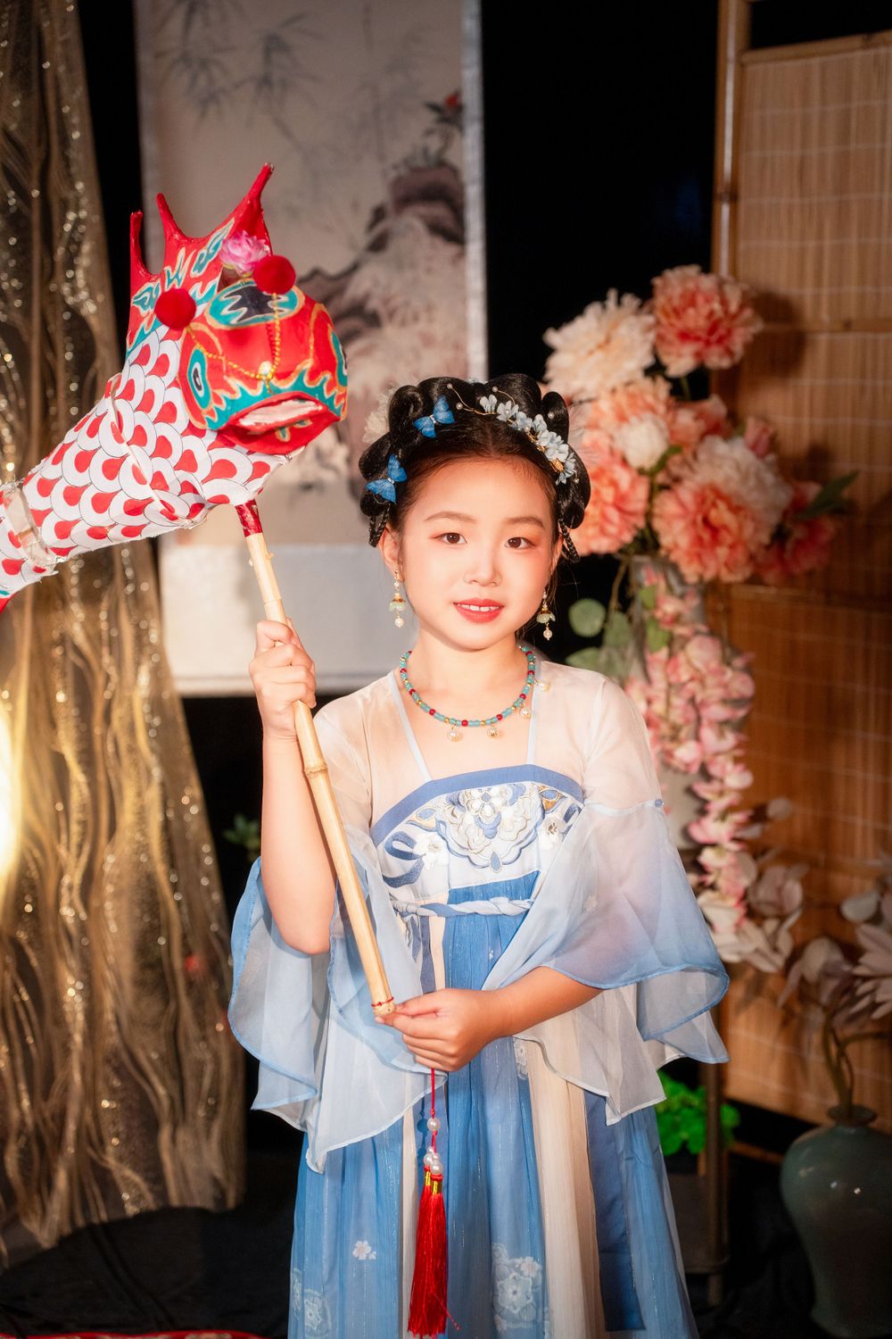 Cute children's studio portrait in an elegant Tang Dynasty Hanfu with dazzling golden props, by Imagine Image Studio.