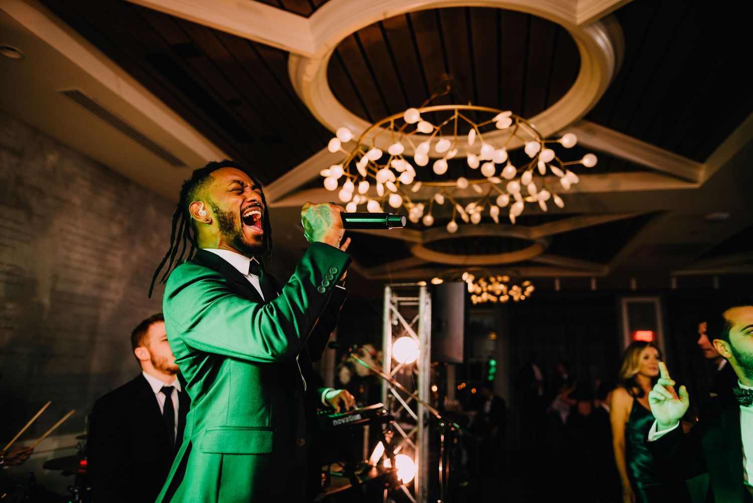 Go Go Gadjet belts out a huge note to the crowd. He sets the music and tone for an epic dance party at Christine Wedding