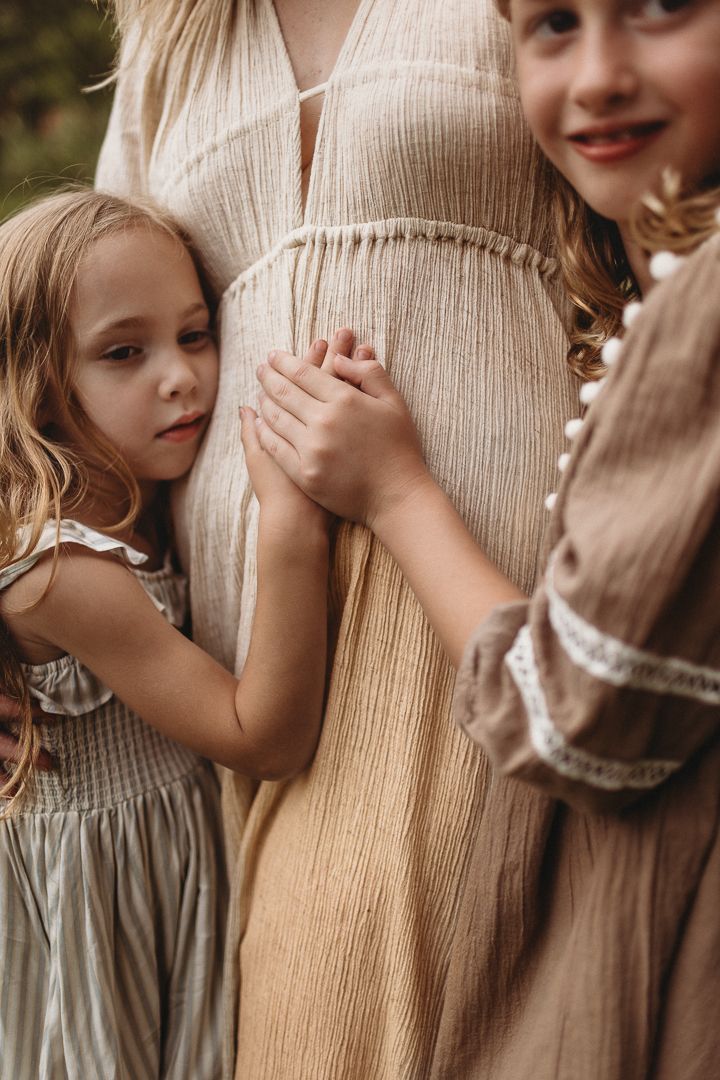 Sweet intimate portraits showing tender moments between people in soft natural lighting.