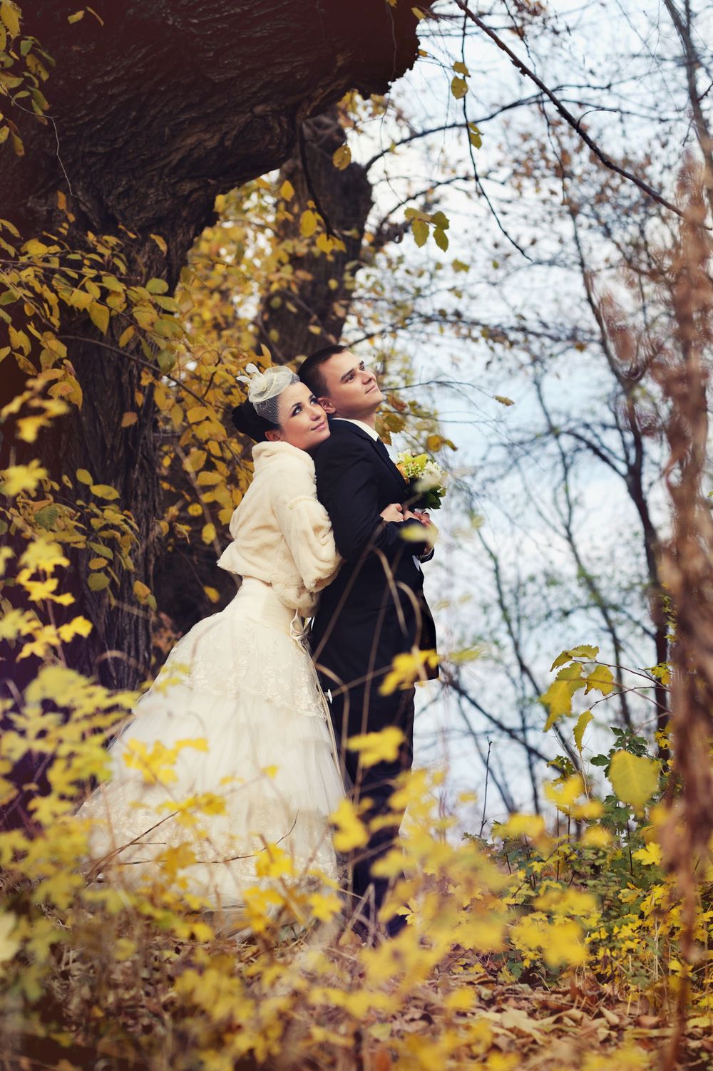 Wedding couple outdoors portrait in an autumn Edmonton park.