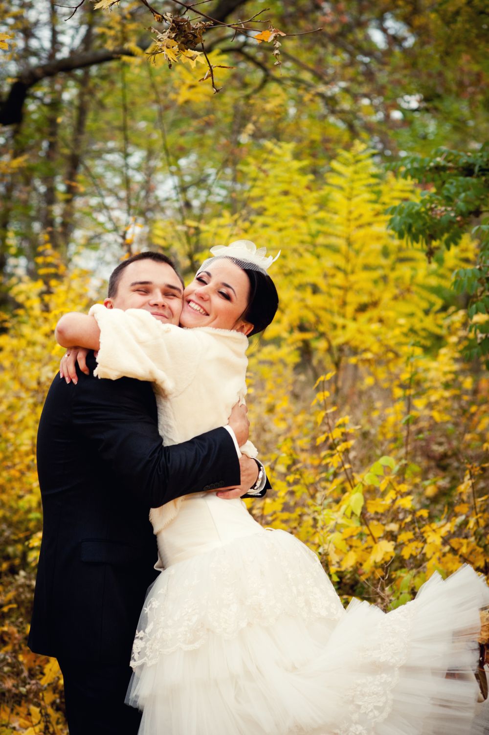 Wedding couple outdoors portrait in an autumn Edmonton park.