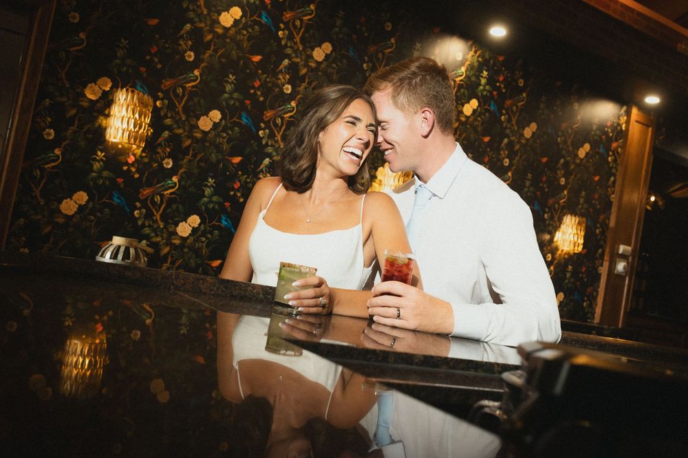 Bride and groom sharing a quiet moment at the bar during their wedding at Land's End Sayville.