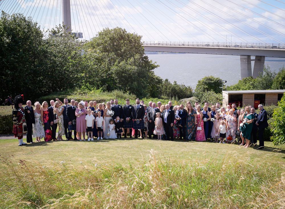 Group family and friends image taken in front of the Queensferry Bridge at the Double Tree HIlton.