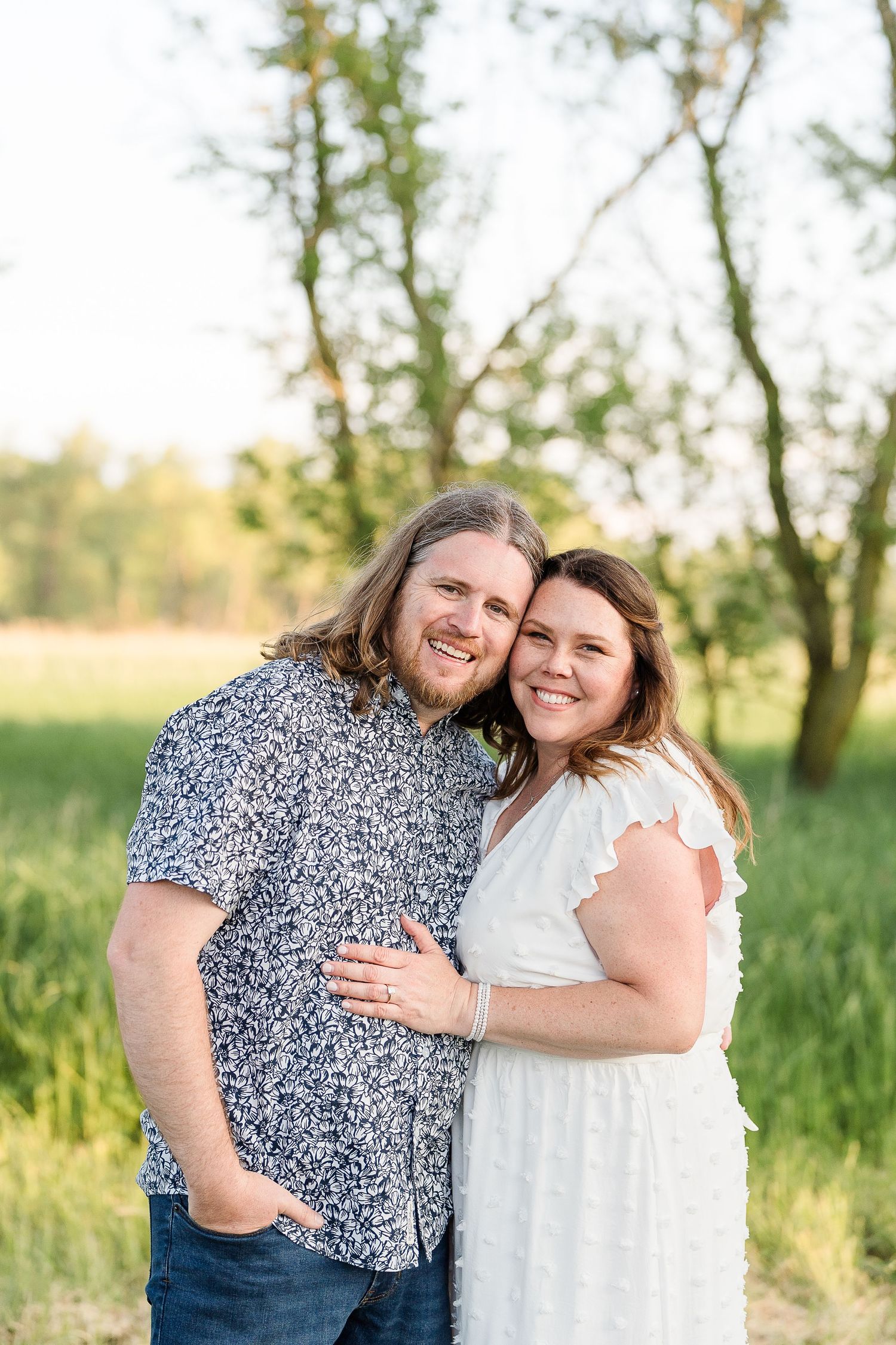 Engaged couple smiling during their Kenosha engagement session.