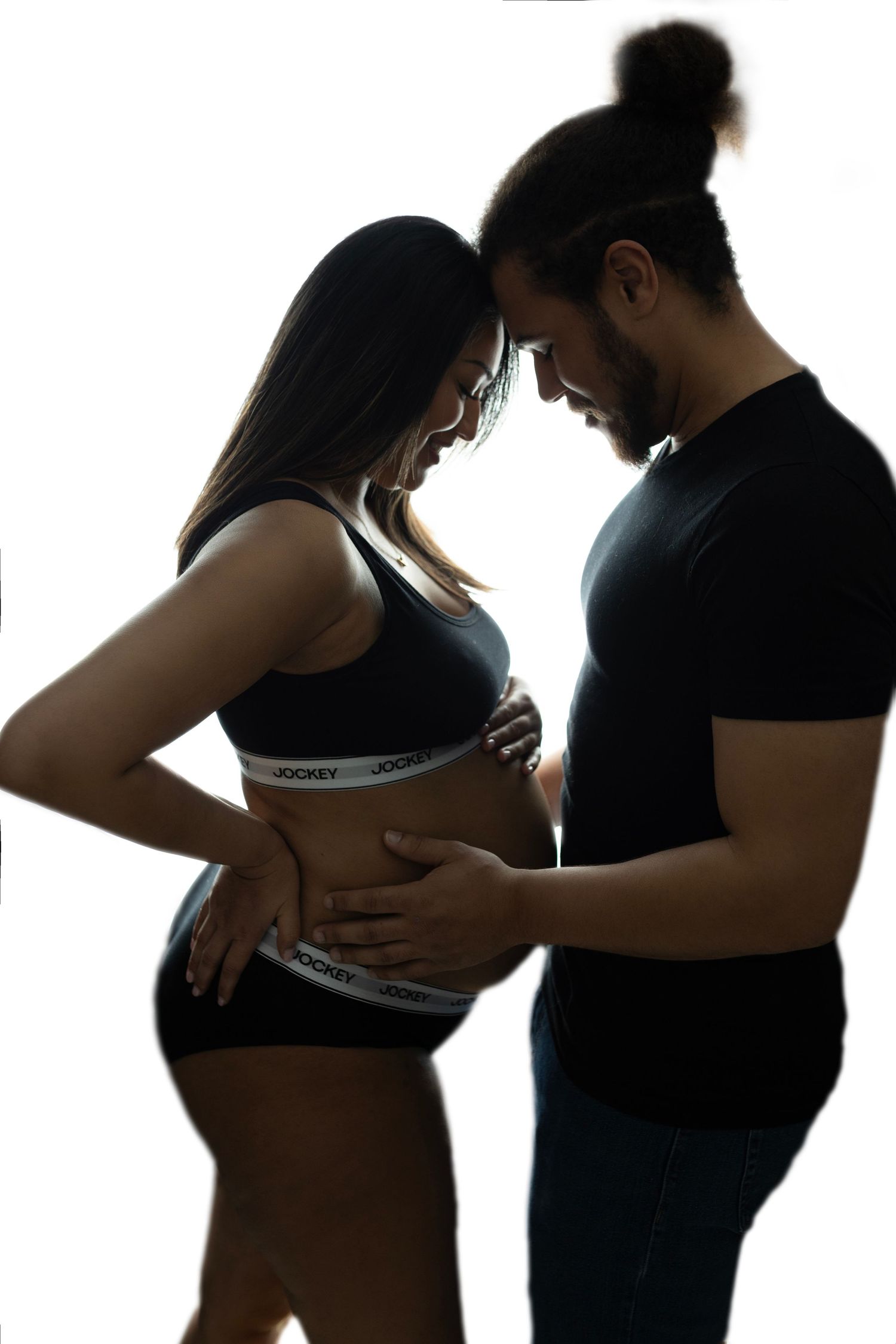 Silhouette series showing progression of pregnancy against white background.
