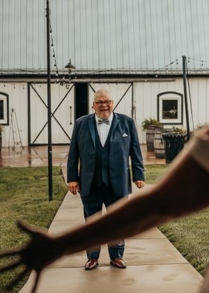 Father of the bride shocked reaction to seeing his daughter for the first time in her wedding dress on her wedding day.
