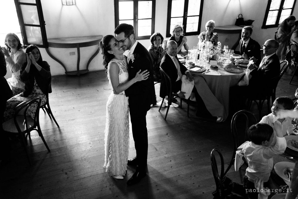 Black and white photo of dancing in an elegant room with vintage details.