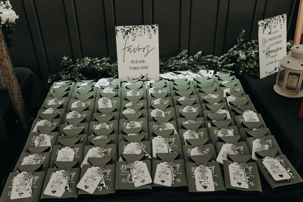 Wedding favor display table with multiple small gift boxes arranged in neat rows.