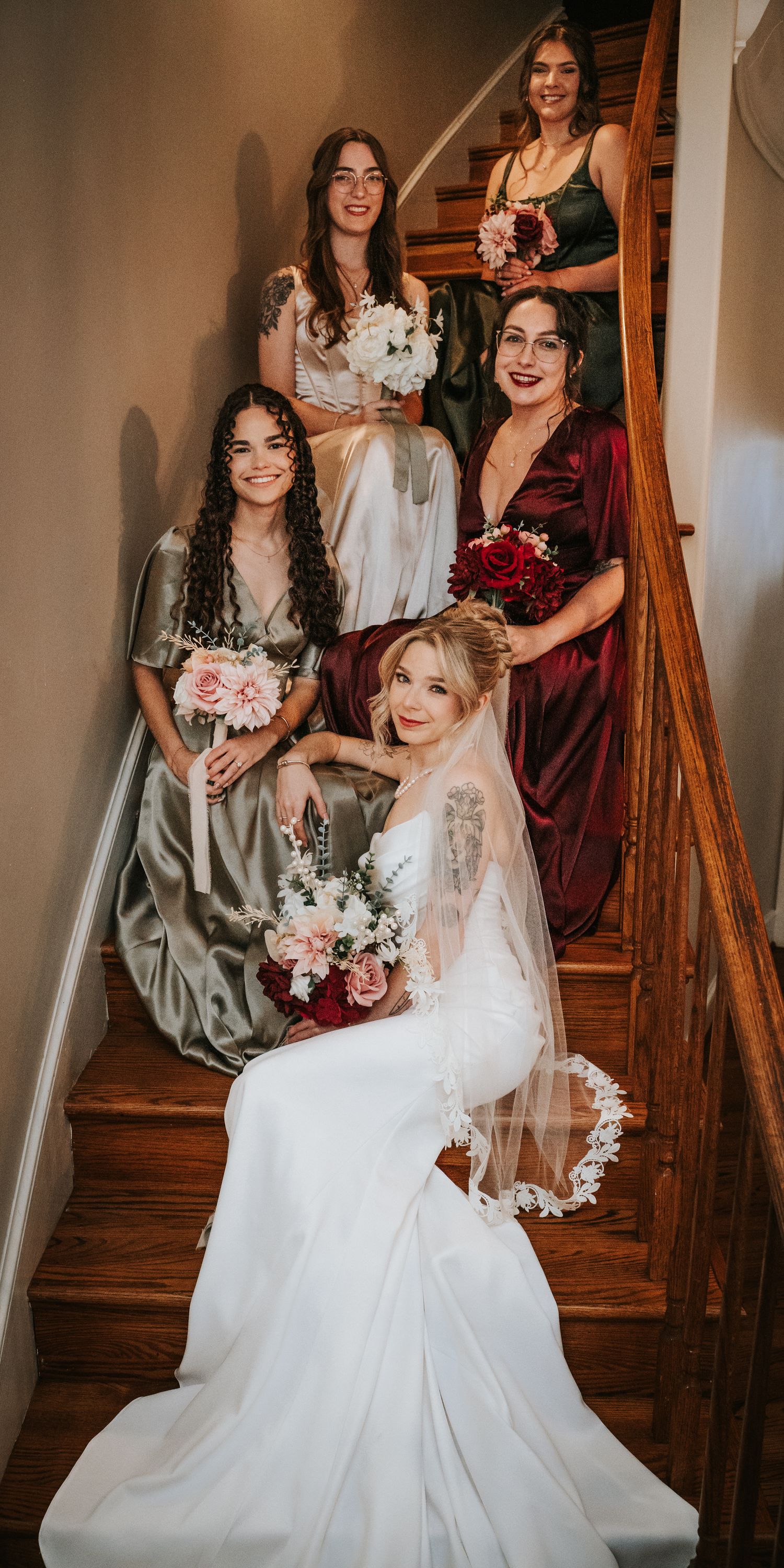 Bride and Bridesmaids lines of for group portraits before wedding.