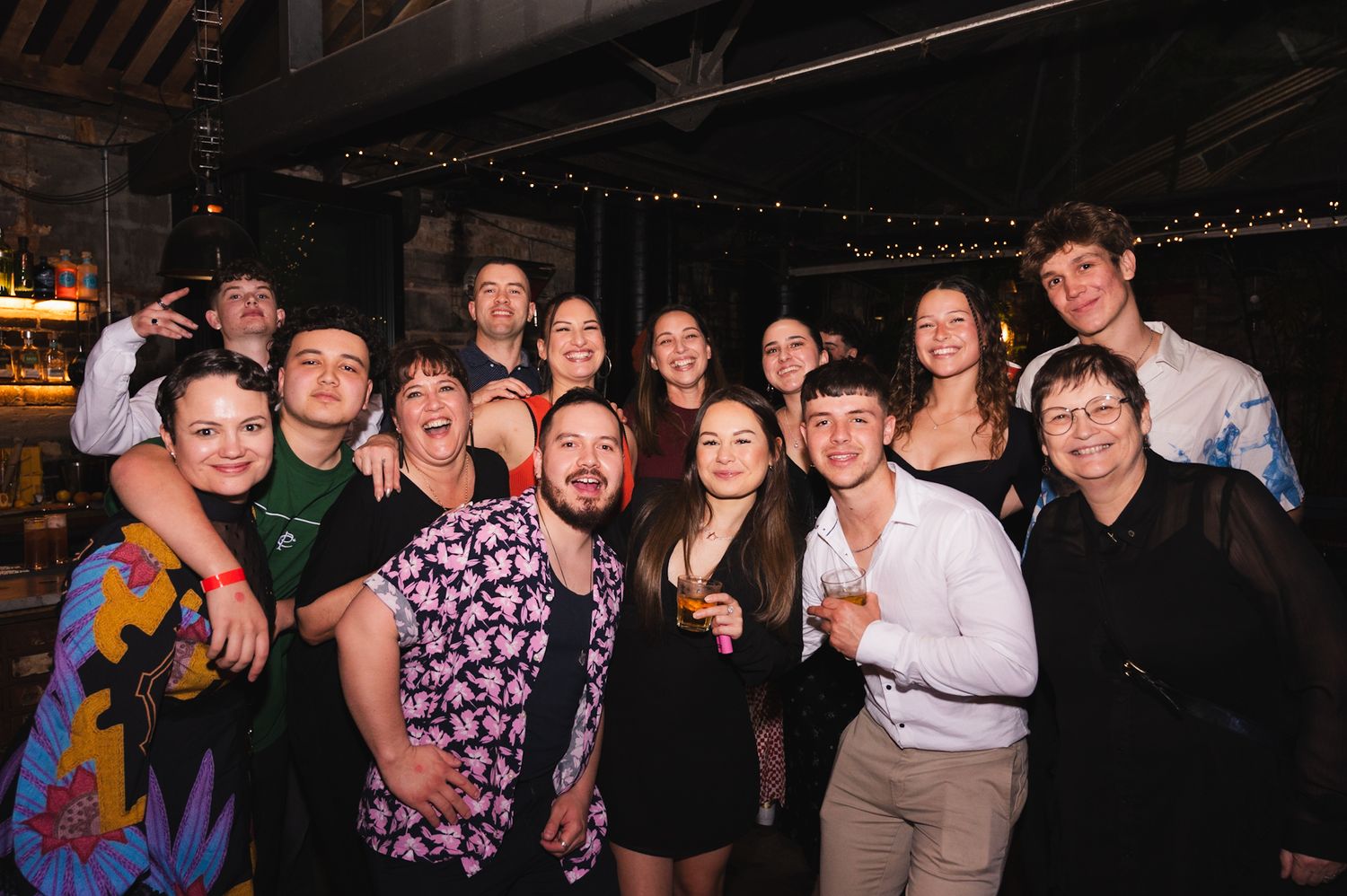 Group photo of the entire family at a 21st birthday party.