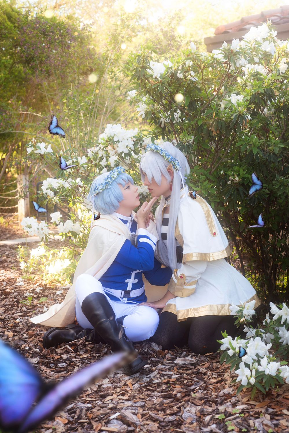 Outdoor natural light cosplay duo shoot of Frieren and Himmel at Bok Tower in Florida vibrant color with cinematic and dramatic posing