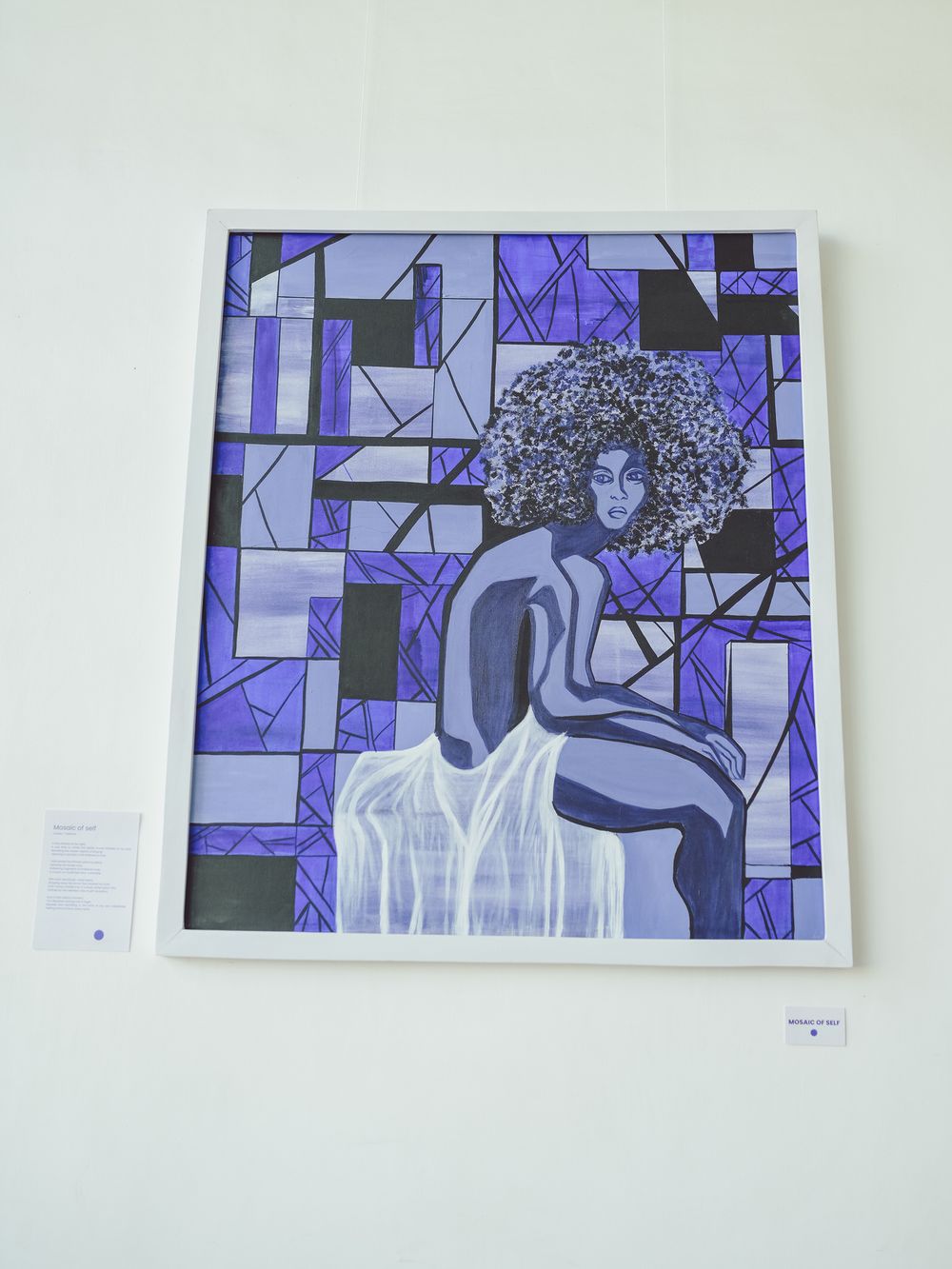 Abstract artwork featuring geometric patterns in shades of purple and blue with a central figure.