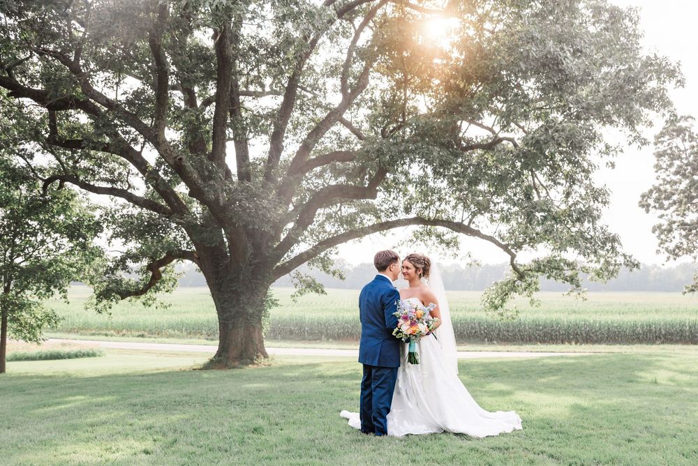 A full bridal part portrait in front of Ivy Manor Bed and Breakfast in Princeton, Kentucky.